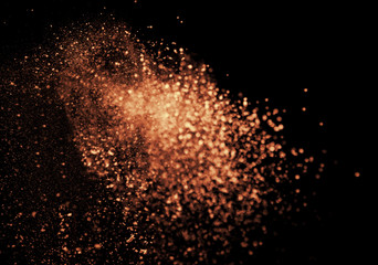 Fototapeta na wymiar a shot from a firearm, an explosion of gunpowder on a black background, a bright flash with flying particles, abstract shape