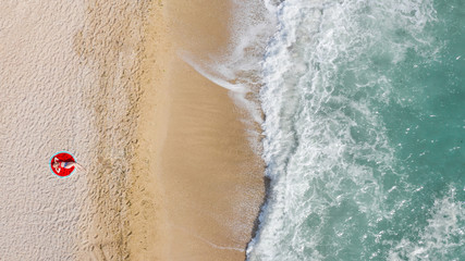 Aerial view of a girl on the beach. Summer time