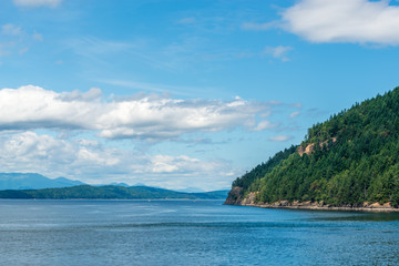 View over Inlet, ocean and island with mountains in beautiful British Columbia. Canada.