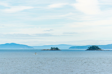 View over Inlet, ocean and island with mountains in beautiful British Columbia. Canada.