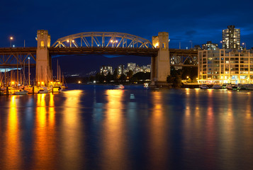 Fototapeta na wymiar Twilight False Creek Burrard Bridge. Burrard Bridge from Granville Island at twilight. Vancouver, British Columbia.