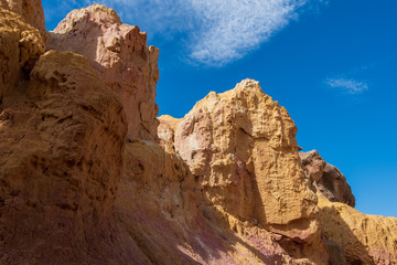 Fototapeta premium Close up low angle landscape of yellow rock formations at Interpretive Paint Mines in Colorado