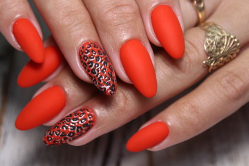 fashionable beige manicure with a silver design