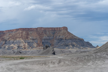 Landscape of blue, grey and yellow barren hills near Hanksville, Utah