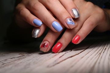 glamorous beautiful manicure on a trendy texture