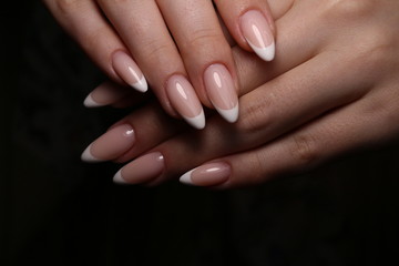 glamorous beautiful manicure on a trendy texture
