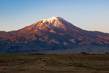 Breathtaking sunset on Mount Ararat, Agri Dagi, the highest mountain in the extreme east of Turkey accepted in Christianity as the resting place of Noah's Ark, snow-capped and dormant compound volcano