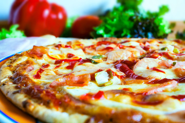 sausage pizza and orphaned on a table