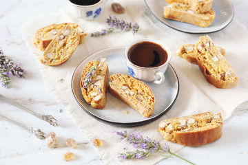 Italian cookies: almond and lavender cantuccini and cup of coffee