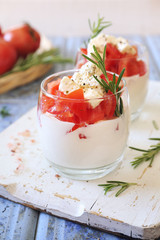 Appetizer. Greek yogurt with cream cheese, tomatoes and salakis cheese, two verrines