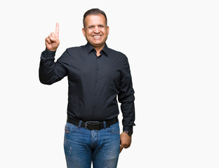 Handsome middle age arab business man over isolated background showing and pointing up with finger number one while smiling confident and happy.