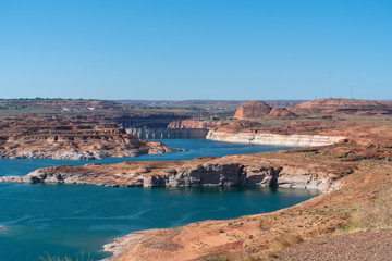 Fototapeta premium Lake Powell high angle landscape of water and pink rock formation in and around the shoreline