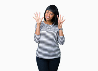 Beautiful young african american woman wearing stripes sweater over isolated background showing and...