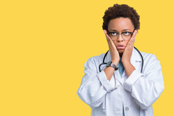 Young african american doctor woman wearing medical coat over isolated background Tired hands covering face, depression and sadness, upset and irritated for problem