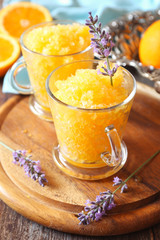 Orange granita, frozen summer dessert and  blooming lavender © photosimysia