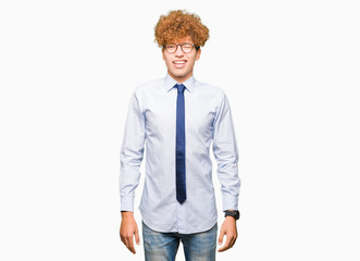 Young handsome business man with afro wearing glasses winking looking at the camera with sexy...