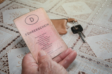 Old senior hand with German driving license 