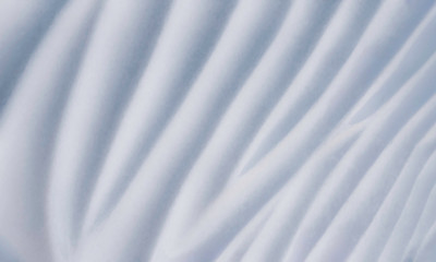 Uneven texture or background of a gray plaster surface. Abstract decorative pattern of gypsum or stucco.