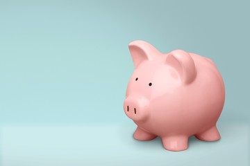 Hand putting coin to piggy bank