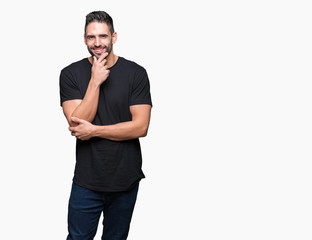 Young handsome man over isolated background looking confident at the camera with smile with crossed arms and hand raised on chin. Thinking positive.