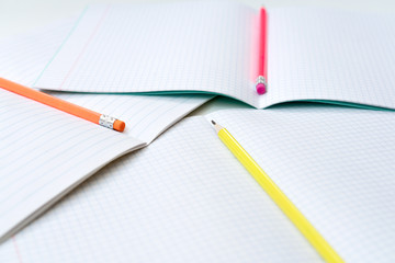 Back to school, education concept - colourful pencils close up and composition book on background for educational new academic year begin or study term start. Mock-up Copy space