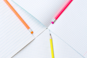 Back to school, education concept - colourful pencils close up and composition book on background for educational new academic year begin or study term start. Mock-up Copy space