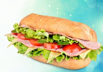 Ham and cheese salad submarine sandwich from freshly cut baguette