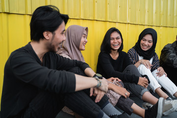 Group of young people hanging out at the rooftop building