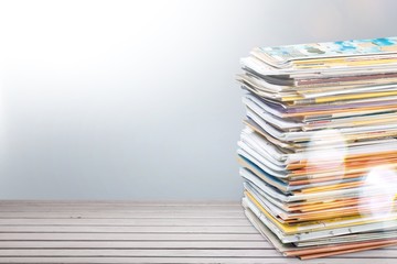 Pile of newspapers on white background