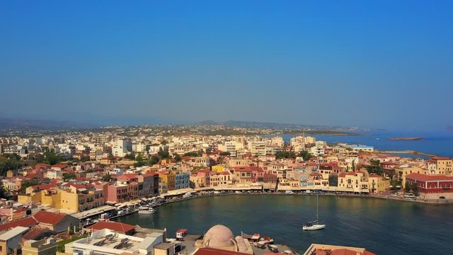Aerial: Sailboat in Beautiful Port of Scenic Town, Crete, Greece