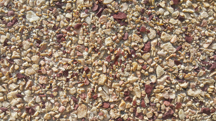 surface structure created by spraying, sifted sand painted crimson and cream small stones, building facades, wall, largest texture