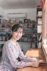 Women eating cocoa and playing in cafe
