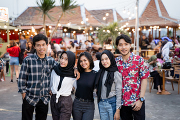 friends having fun outdoors walking together going hangout