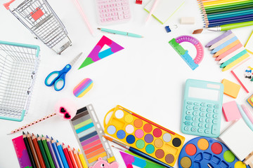Fototapeta na wymiar School supplies. Set of colorful school accessories isolated on the white table.