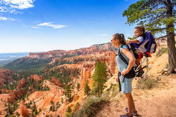 Family hiking in Bryce Canyon National Park, Utah, USA looking out at a scenic view
