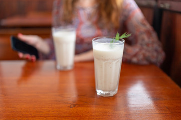glass of milk on wooden table