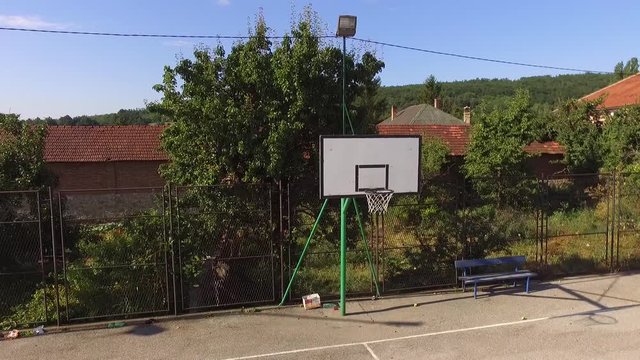An empty basketball court flying around the basket