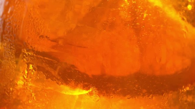 Refreshing orange drink in the sun - 180fps