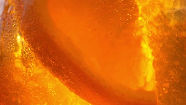 Refreshing orange drink in the sun - 180fps