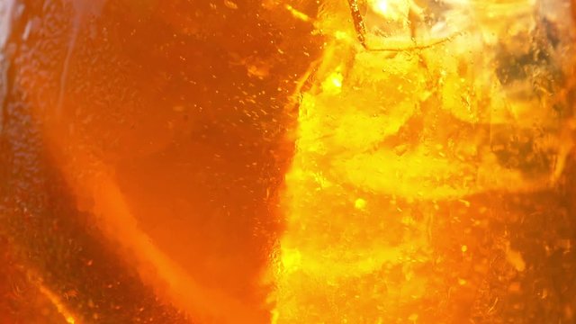 Refreshing orange drink in the sun - 180fps