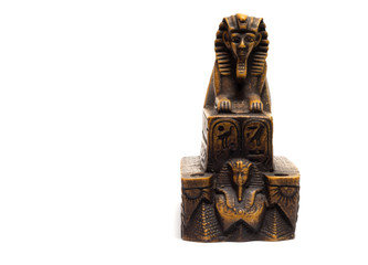 sphinx figurine stands on a white background