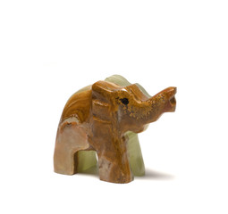 figurine of an elephant from malachite on a white background