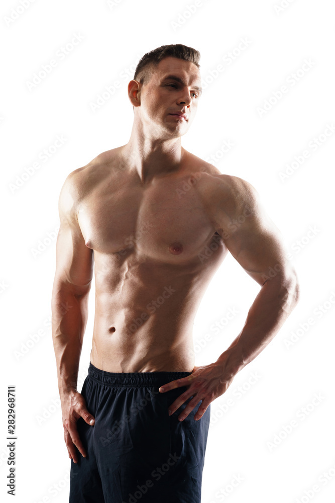 Wall mural strong, fit and sporty bodybuilder man over white background. sport and fitness.