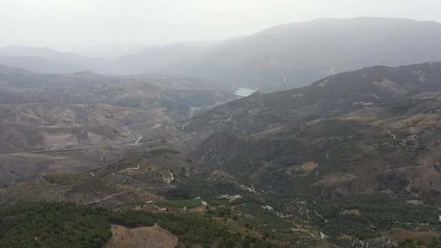 Misty Lecrin Valley Granada, Panning left over  mountains and hills.