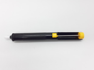 Black Yellow Colored Hand Solder Tin Extractor for Electronic Circuit Fix in White Isolated Background