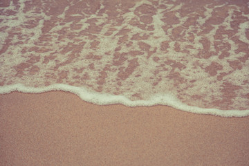 Beach sand and ocean waves
