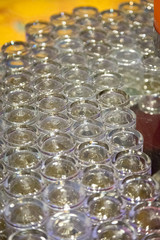 Many glasses with  orange juice on buffet table