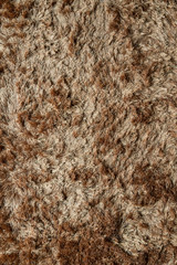 Brown fabric carpet with long pile texture