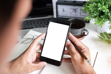 Cropped shot view of man hands holding smart phone with blank copy space screen for your text message or information content, female reading text message on cell telephone during in urban setting. 