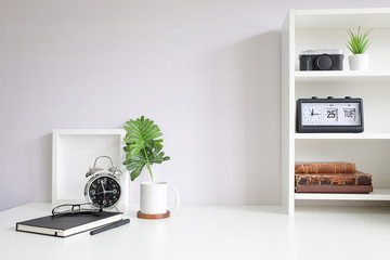 Mockup workspace desk and copy space books,plant and coffee on white desk.